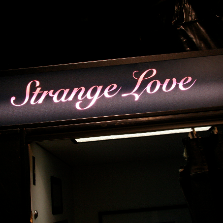 strangeLove featured - bright sign with strange love written