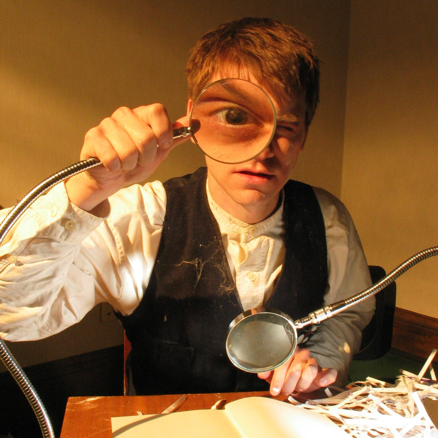 The hidden room - 2007 - boy with magnifying glass that magnifies one of his eye-